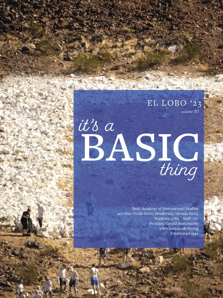 Title page of the El Lobo '23 yearbook (volume 80) for Basic Academy of International Studies, themed "it's a BASIC thing," showing students walking near a rocky hillside in Henderson, Nevada.