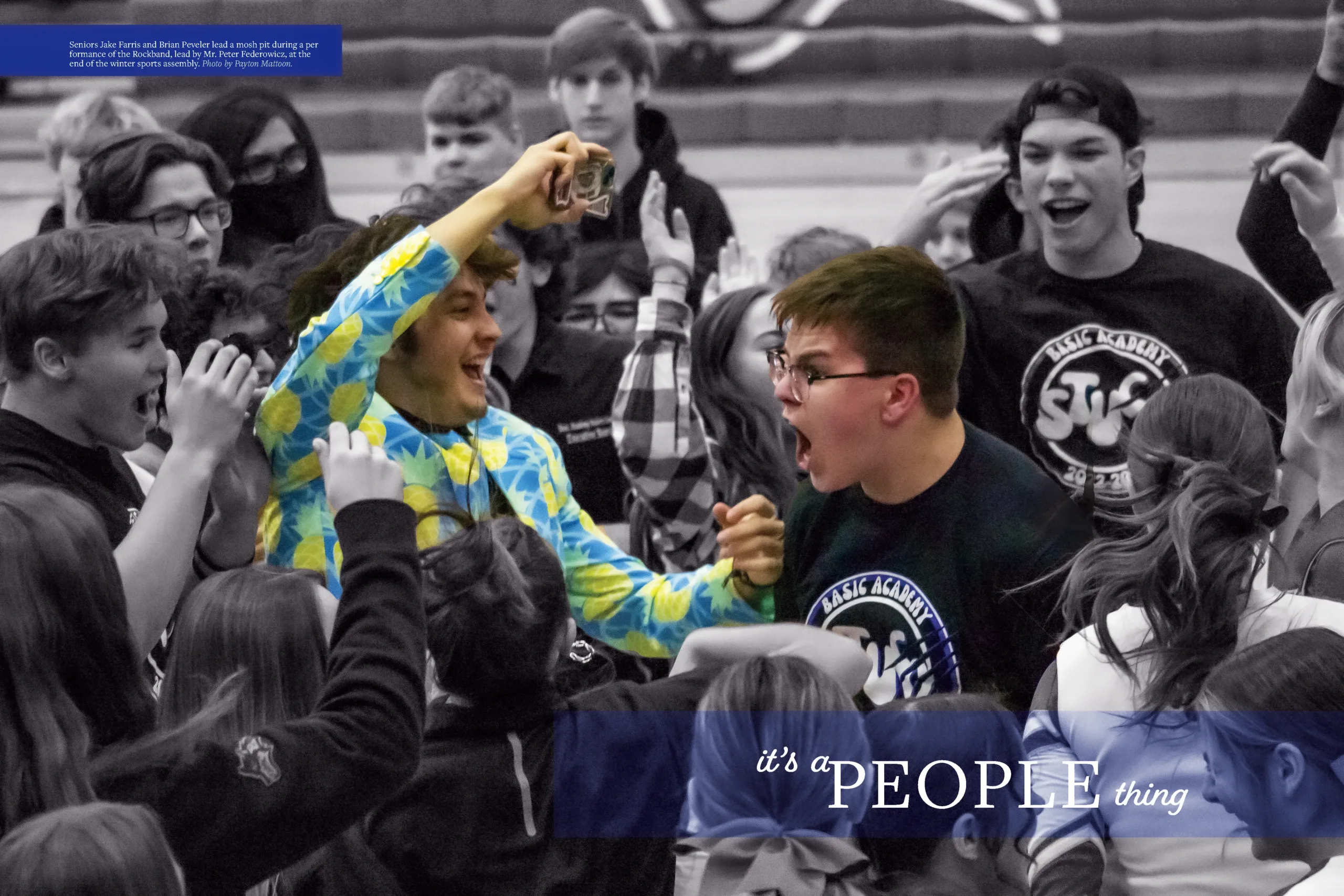 A yearbook spread from the 2023 El Lobo yearbook titled "it's a PEOPLE thing," featuring a large central photo of students in the "Blue Zone" cheering at an assembly. One student in a blue and yellow Hawaiian shirt is particularly expressive.