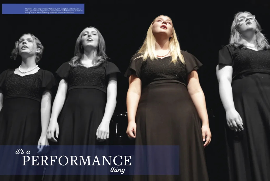 Yearbook spread titled "Performance Thing" showing students on stage in black costumes during a choir production, including a central photo of a female student singing.