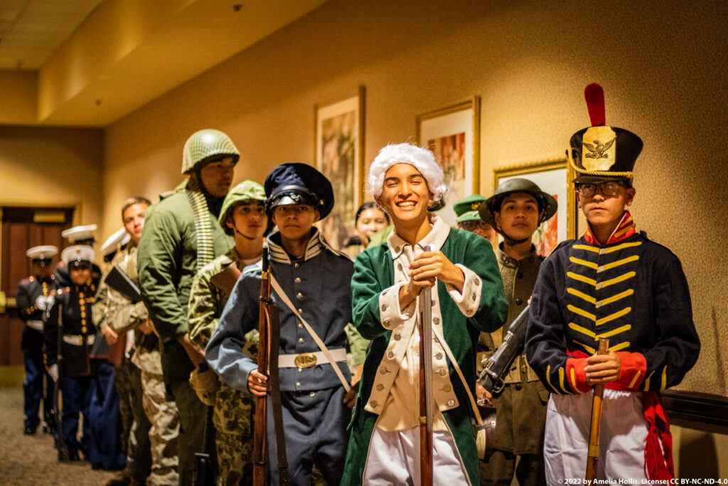 Students performing a historical military play.
