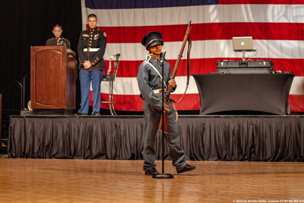 Students performing a historical military play.