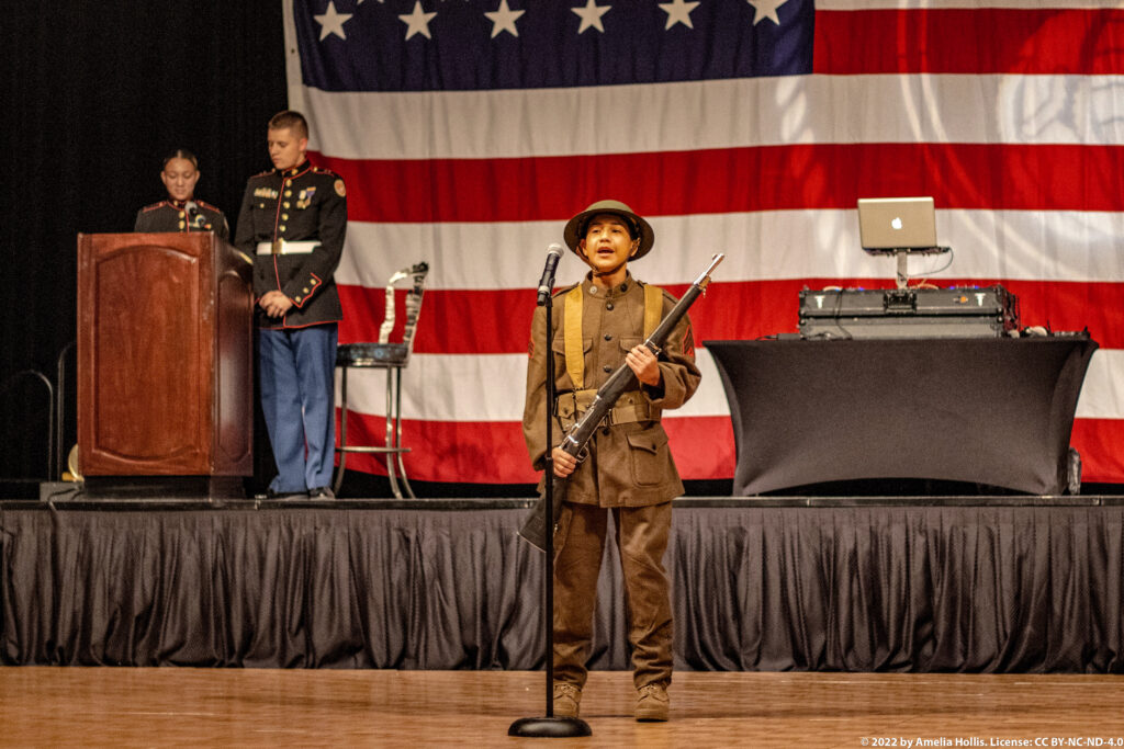 Students performing a historical military play.
